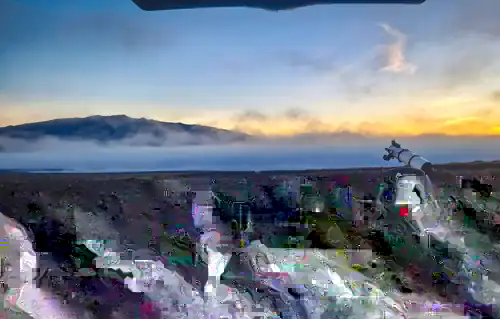 Telescope observing setup above the clouds at sunset on Maunakea, Hawaiʻi